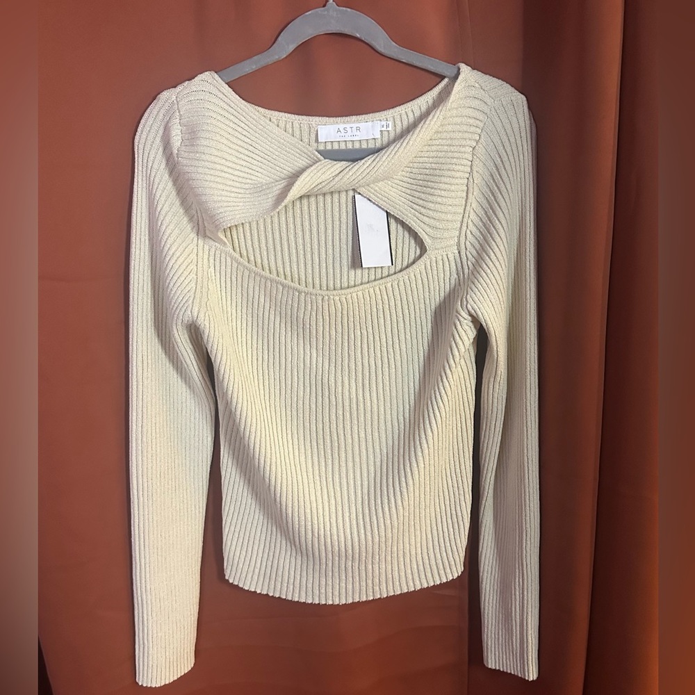 Knit sweater with cross / twist across chest. Size XL